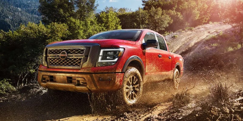 Red 2024 Nissan TITAN Off-Roading Down Hill College Park, MD