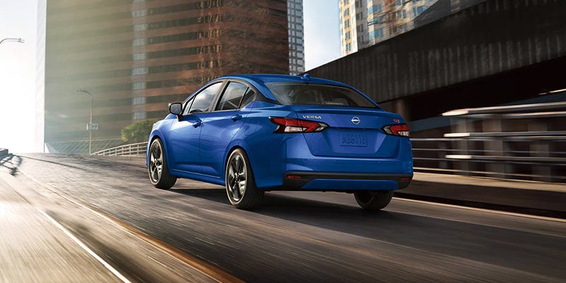 Blue 2024 Nissan Versa Driving On Highway College Park, MD